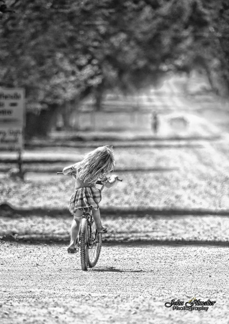 Girl on a Bike by JohnFilmalter