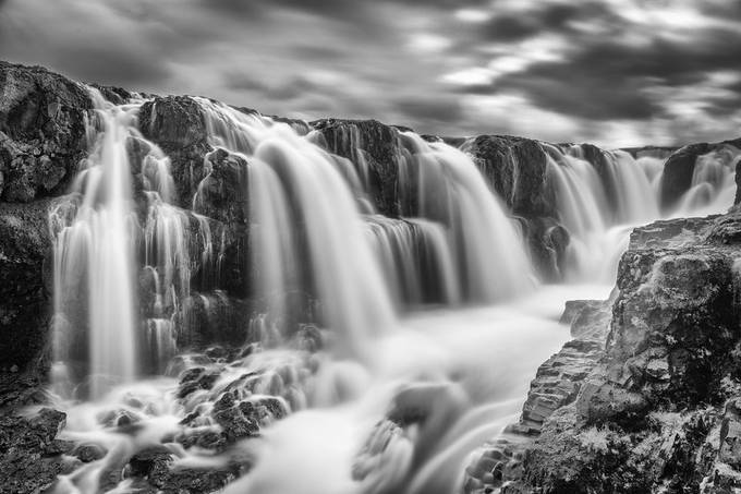 60 second exposure of kolugljüfur wayerfalls in iceland at high noon while surrounded by a constant  swarm of plague size, black flies.     by rickwagonheim - Monochrome Waterfalls Photo Contest